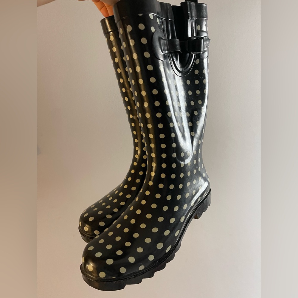 Polka dot rain boots warn twice.